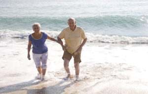 An elderly couple enjoy the beach which is located close to UPA's Retirement Village and Residential Care facility in Stanwell Park, New South Wales.